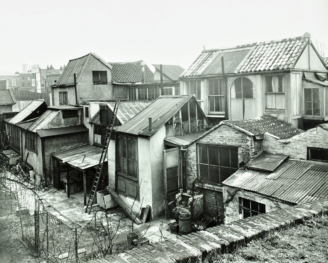 A group of houses with roofs Description automatically generated with medium confidence